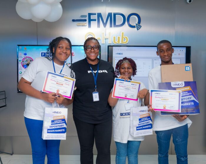 Ms. Kaodi Ugoji, FMDQ Group Chief Operating Officer, with some pupils and secondary school students who benefitted from the Next Generation Financial Markets Empowerment, organised by FMDQ Group Plc. in Lagos