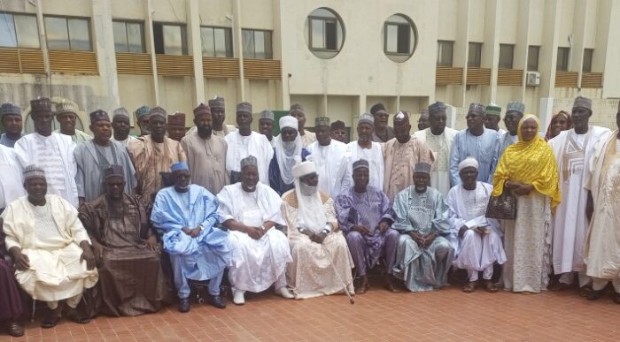 Defence Minister, Alhaji Mohammed Badaru in a photo section with a delegation from Jigawa, led by the state Governor, Malam Umar Namadi