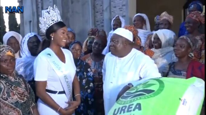 Queen Precious Okoye, the reigning Miss Africa, alongside the Okere of Saki, Khalid Olabisi, the Ado Oyedepo III, during the implementation of her pet project on Agro-industrialisation where she empowered more than 30 female farmers with 50kg bags of fertiliser