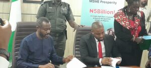 L-R: Managing Director of Sterling Bank, Abubakar Suleiman and SMEDAN’s Director-General, Charles Odii, signing a N5billion MoU to support small businesses 