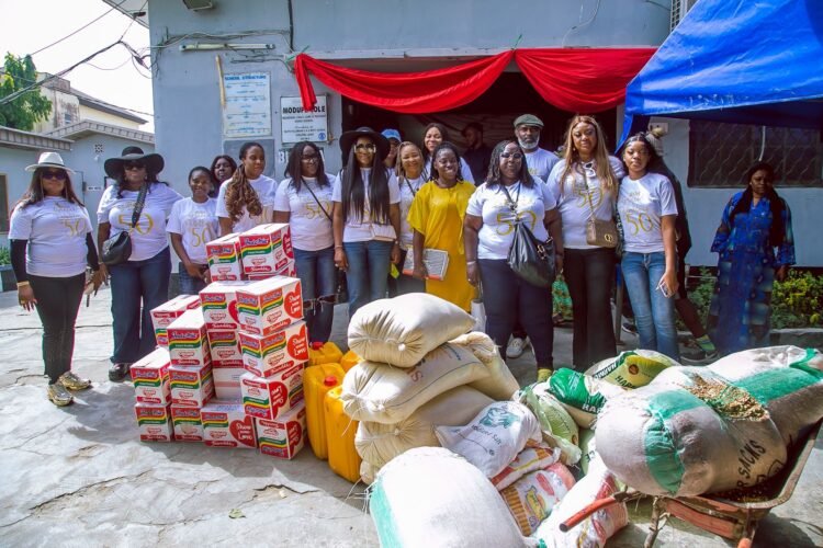 The Initiator, B.N. Peters Foundation, Bibiana Peters, alongside Mrs Olufunmilayo Bamidele-Osho, the Vice Principal, Modupe Cole Memorial Child Care and Treatment Home School, Surulere, receiving the foundation's donation to the school.