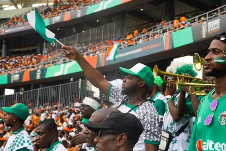 Members of the Nigeria Football Supporters Club in Cote d'Ivoire, cheering the Super Eagles