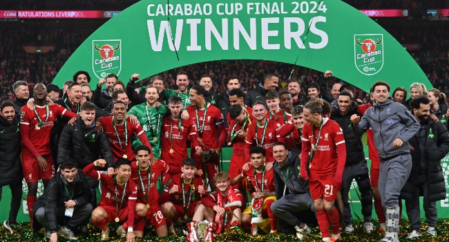 Liverpool players celebrate League Cup win against Chelsea