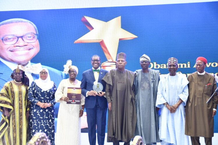 4rd from left: Dr Akinwumi Adesina, President, Africa Development Bank (AfDB), with his award; 5th from left: Vice-President, Kashim Shettima; Gov. Babajide Sanwo-Olu of Lagos, 6th from left; former Head of State, Gen. Yakubu Gowon 7th from left and Chief Emeka Anyaoku, former Commonwealth Secretary-General, with other dignitaries at the 2023 Award of Obafemi Awolowo Prize for Leadership in Lagos