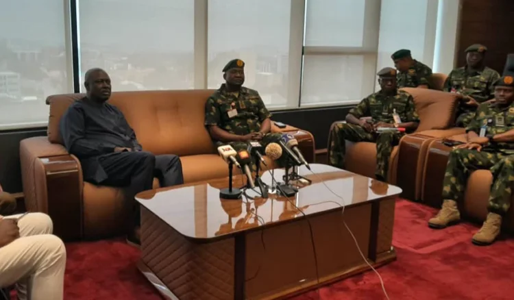 Sen. Heineken Lokpobiri, Minister of State for Petroleum Resources (Oil) (Left) during a visit by the Chief of Defence Staff, Gen. Christopher Musa (Right) and other top military officers