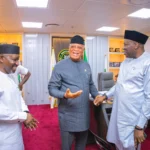 Minister of State for Petroleum Resources (Gas) Ekperikpe Ekpo (Left) and the Permanent Secretary, Ministry of Petroleum Resources, Amb. Nicholas Ella (Right) welcoming Governor of Akwa Ibom State, Pastor Umo Eno to the Ministry
