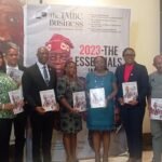Mr Tony Monye, Editor in Chief, TMBC business magazine, flanked by well-wishers at the magazine launch on Tuesday in Lagos.