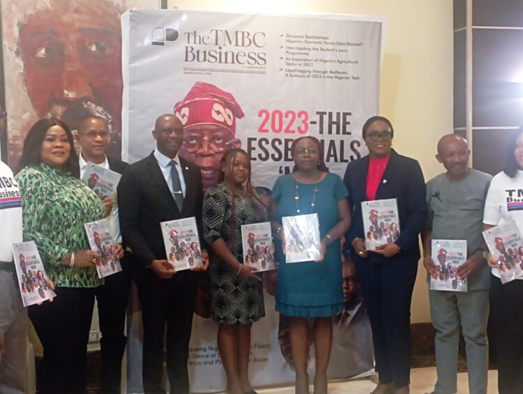 Mr Tony Monye, Editor in Chief, TMBC business magazine, flanked by well-wishers at the magazine launch on Tuesday in Lagos.