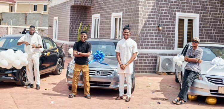 Third from left: Ace gospel singer and Spotlite Nation record label owner, Moses Bliss with the three signees under his label, Godfrey Gad, Neeja and Son Music. whom he gifted brand new cars.