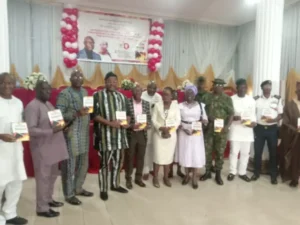 4th, 5th from right, Mr and Mrs Lasisi, employees of LASG, during the launch of their book on fire prevention and management on Thursday in Lagos.