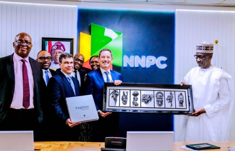 Managing Director, NNPC Energy Services Limited (EnServ), Sophia Mbakwe (5th from right) and Chief Executive Officer, Schlumberger (SLB), Mr. Olivier Le Peuch (4th from left) exchange documents shortly after the signing ceremony of a technical partnership agreement on bolstering upstream operations between the two companies, held at the NNPC Towers in Abuja, on Thursday.