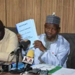 L-R: Secretary General of the Nigeria Olympic Committee (NOC), Tunde Popoola and the President of NOC, Habu Gumel, receiving the reports of committees on its constitution review and the refurbishment of sports infrastructure