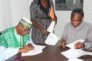 The Vice-Chancellor, University of Abuja, Prof. Abdul-Rasheed Na’Allah and President of Gemological Institute of Nigeria (GIN), Prof. Adesoji Adesugba, at an MoU signing in Abuja