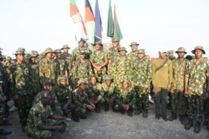 The Commander, Guards Brigade, Brig.-Gen. Olabisi Onasanya, and troops at the Summit of Aso Rock during the 2025 Ascent of Aso Rock in Abuja on (20/12/25)