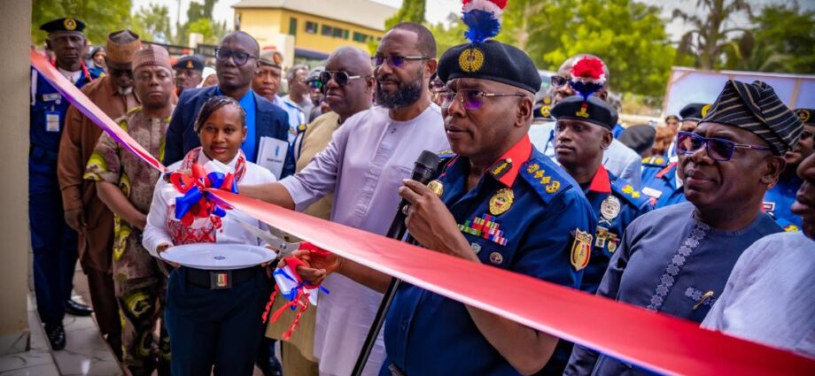 The Nigeria Security and Civil Defence Corps (NSCDC) Commandant General, Ahmed Audi,(2nd Right) and Tantita Managing Director, Kestin Ebimorbowei (3rd Right) at the unveileing of a state-of-the-art Command and Control Centre to boost security in Nigeria, on Thursday in Abuja
