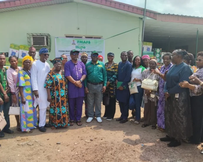 A cross section of Farmer Beneficiaries with the Permanent Secretary Federal Ministry of Agriculture and Food Security,Dr Marcus Ogunbiyi at Agege on Thursday