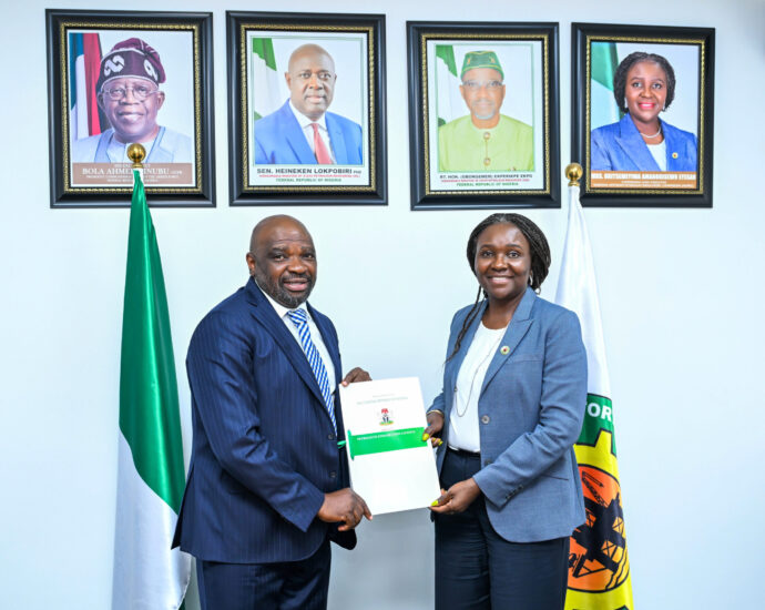 The Managing Director of SeaSeisGeophysical Limited, Mr Goke Adeniyi and Commission Chief Executive, NUPRC, Mrs Oritsemeyiwa Eyesan, after the agreement signing in Abuja on Wednesday