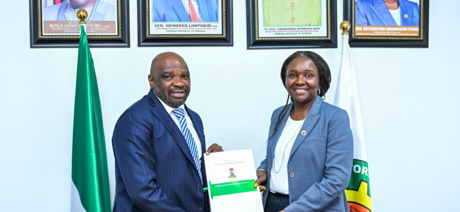 The Managing Director of SeaSeisGeophysical Limited, Mr Goke Adeniyi and Commission Chief Executive, NUPRC, Mrs Oritsemeyiwa Eyesan, after the agreement signing in Abuja on Wednesday
