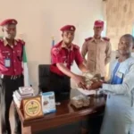 The cash being handed over to the victims by the FRSC Zaria Unit Commander, Chief Route Commander Nasiru Falgore