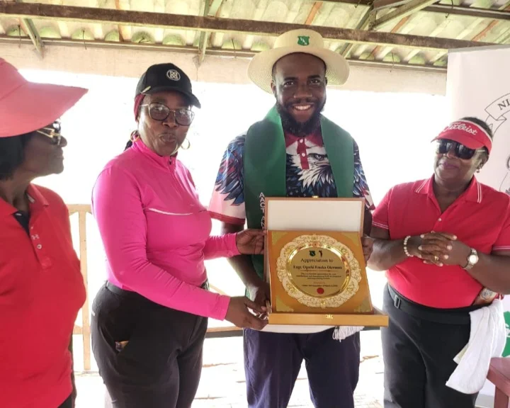 LGAN President, Lami Ahmed decorating Egnr Ogechi Okwuosa as an AACT Ambassador during a sensitisation visit at the Enugu Golf Club on Monday.