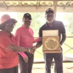LGAN President, Lami Ahmed presenting an award of appreciation to Chief Emeka Mamah, the Chief Executive Officer of Ifesinachi during an AACT sensitisation visit at the Enugu Golf Club on Monday. (PhotoCredit:NAN)