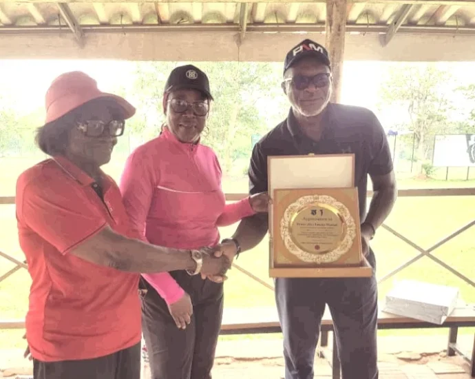 LGAN President, Lami Ahmed presenting an award of appreciation to Chief Emeka Mamah, the Chief Executive Officer of Ifesinachi during an AACT sensitisation visit at the Enugu Golf Club on Monday. (PhotoCredit:NAN)