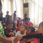 Children receiving gifts from the founder of Cute Kids Haven Foundation, to commemorate the 2026 Children’s Day.