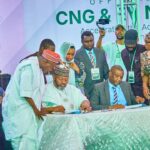 Seated L-R: Barrister Ismael Ahmed, Executive Chairman, Presidential Compressed Natural Gas Initiative (PCNGI); and Mr. Nazif Ibrahim, Regional Head Northeast and Northwest, LOTUS Bank; signing the PCNGI partnership agreement while other dignitaries watch in Kano, Kano State
