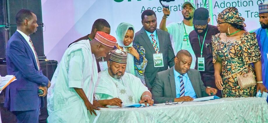 Seated L-R: Barrister Ismael Ahmed, Executive Chairman, Presidential Compressed Natural Gas Initiative (PCNGI); and Mr. Nazif Ibrahim, Regional Head Northeast and Northwest, LOTUS Bank; signing the PCNGI partnership agreement while other dignitaries watch in Kano, Kano State