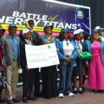 Mrs Emmanuella Arukwe, Managing Director, NNPC Foundation Ltd. (3rd right), with Mr Chris Akinsowon, Principal, Premier Academy, (2nd left) and other officials and students at the “Battle of Energy Titans Award/Prize Giving Ceremony” on Tuesday in Abuja.