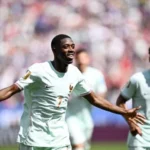 Dembele celebrating his hat trick against Norway