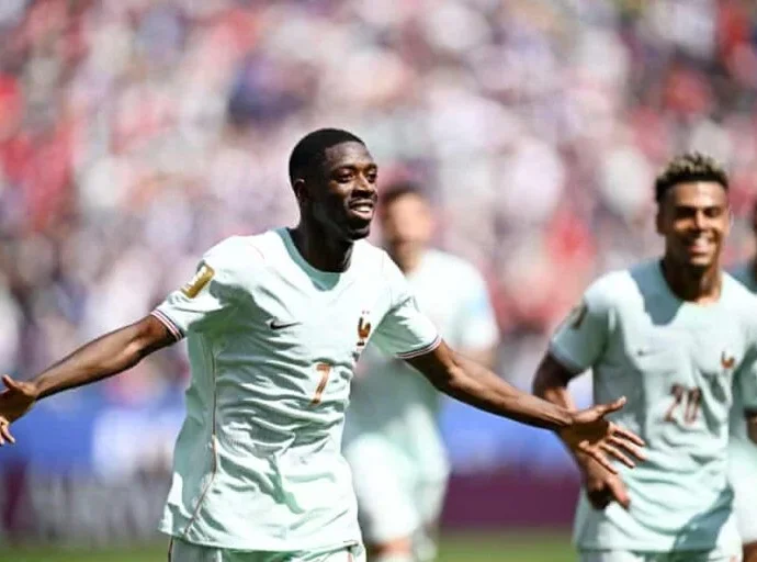 Dembele celebrating his hat trick against Norway