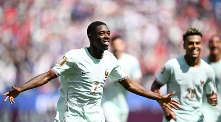Dembele celebrating his hat trick against Norway