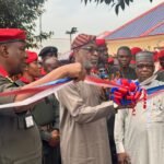 The Minister of Solid Minerals, Dr Dele Alake with others at the inauguration of eight new gun trucks on Wednesday at the NSCDC Headquarters.