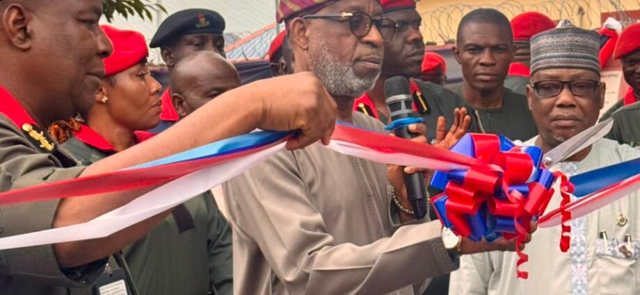 The Minister of Solid Minerals, Dr Dele Alake with others at the inauguration of eight new gun trucks on Wednesday at the NSCDC Headquarters.