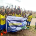 Students of Eziachi Secondary School, Orlu in Imo, lifting the trophy following their victory at the preliminary stage of the First Bank Sam Okwaraji Nigeria U-16 Secondary Schools Football Championship, in Owerri, on Tuesday.