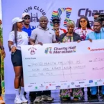 Organisers of the Run Club Abuja Charity Half Marathon presenting the cheque to the selected hospitals in FCT