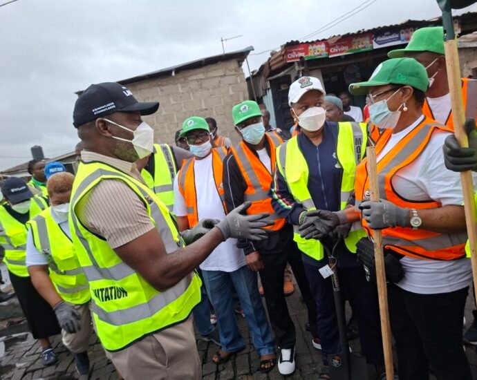 Permanent Secretary, Public Service Office, Mrs Sukanmi Oyegbola (black long sleeve) during the environmental sanitation on Saturday