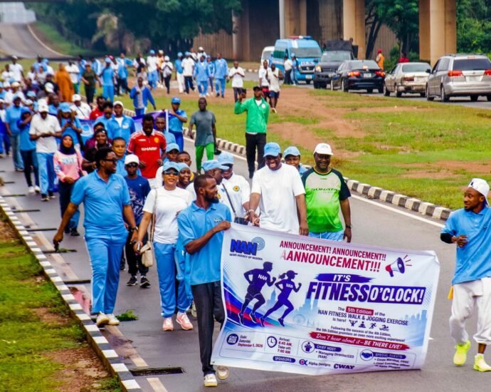 Participants at the fifth quarterly fitness walk of the News Agency of Nigeria in Abuja