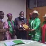 Lami Ahmed, the President, Ladies Golf Association of Nigeria (LGAN) presents an award of appreciation to Prof. Mahmud Raji, CMD of National Hospital, Abuja, represented by Dr Surajudeen Bello, the Deputy CMAC during a courtesy visit by the LGAN president and delegation to the hospital.(PhotoCredit:NAN)