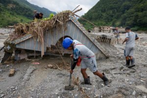 Nepal Police and Armed Police Force (APF) members search the house of Chandika Kumari Shrestha, who was rescued alive on Saturday, for more survivors and victims of the deadly flash floods and mudslides, in Betrawati, Nuwakot district, Nepal,