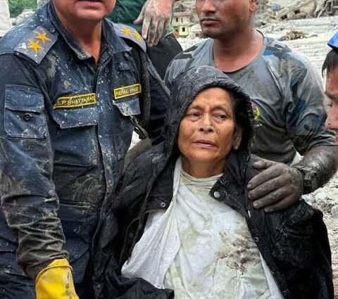 Nepal Police and Armed Police Force (APF) members rescued Chandika Kumari Shrestha, victim of the deadly flash floods and mudslides, in Betrawati, Nuwakot District, Nepal,