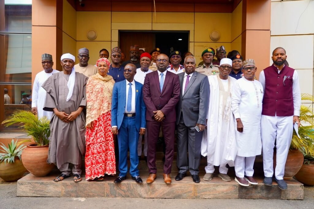 The Minister of Interior, Dr Olubunmi Tunji-Ojo with others at the inauguration of 10-member independent committee investigating the deaths of 37 suspected illegal miners on Tuesday in Abuja