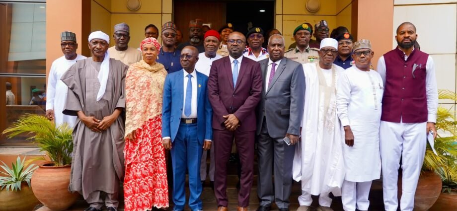 The Minister of Interior, Dr Olubunmi Tunji-Ojo with others at the inauguration of 10-member independent committee investigating the deaths of 37 suspected illegal miners on Tuesday in Abuja