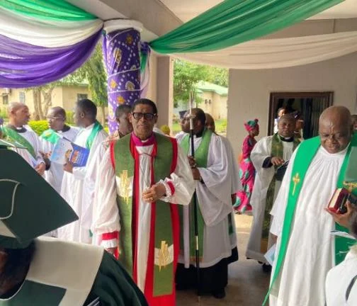Middle: Most Rev. Henry Ndukuba, Anglican Primate, flanked by members of the clergy