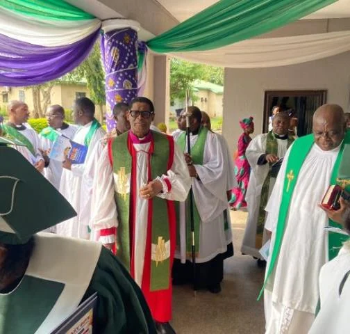 Middle: Most Rev. Henry Ndukuba, Anglican Primate, flanked by members of the clergy
