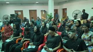 Family members, colleagues and friends, during a Night of Tribute for Mr Peter Onwubuariri, an Assistant Director with NAN attached to the Presidential Villa